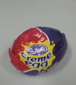 A Creme egg, in its foil wrapper.