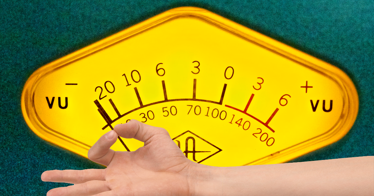 a pinching hand overlaid on top of an image of a VU meter